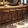 Set of 4 walnut bar stools with footrests, featuring a 360° swivel function, ideal for dining or living room use.