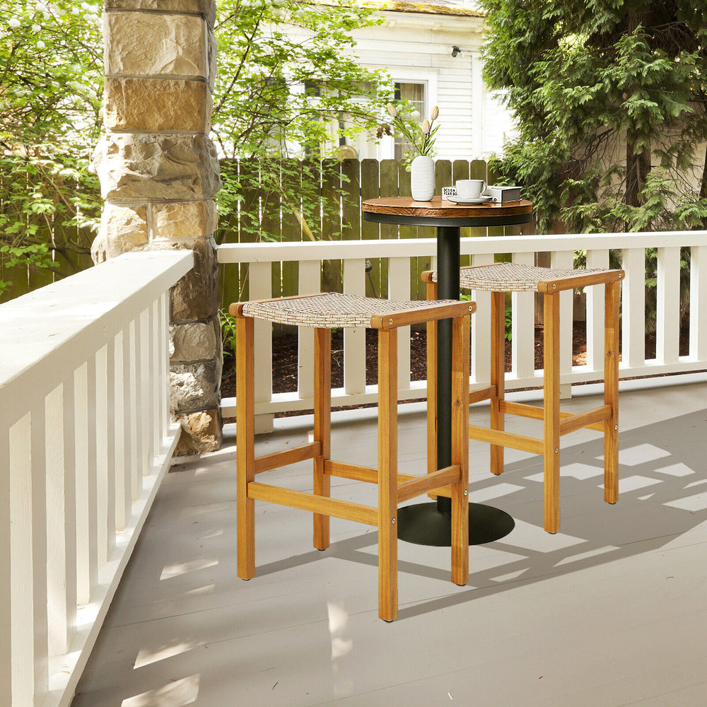 Set of 2 acacia wood bar stools with PE rattan seats, perfect for outdoor patio or balcony relaxation.