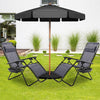 Two gray folding lounge chairs with a black umbrella, perfect for outdoor relaxation in the yard or beach.