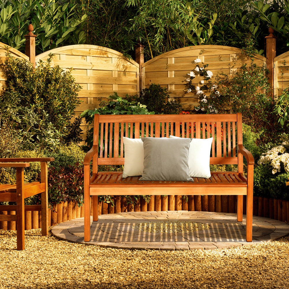 Two-person solid wood garden bench with curved backrest, natural teak color, perfect for outdoor relaxation.