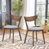 Set of 2 dining chairs with upholstered seats and curved backs, featuring solid rubber wood legs for comfort and style.