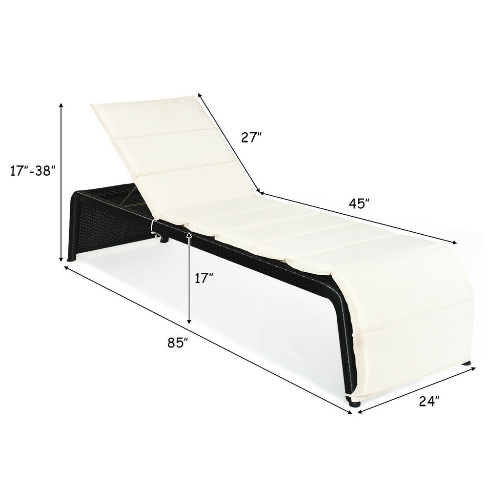 Side view of the adjustable patio rattan lounge chair with removable white cushion, ideal for relaxing in outdoor.
