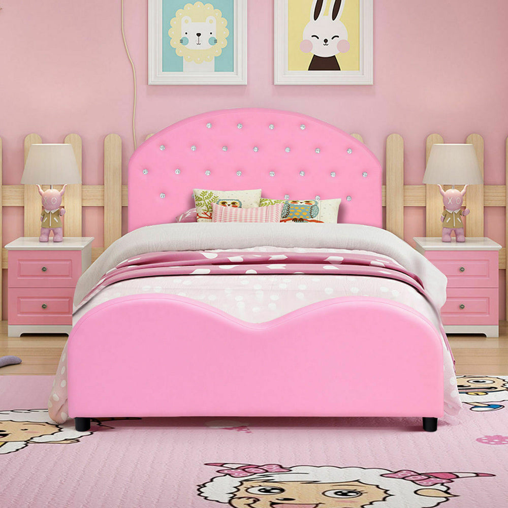 Twin size upholstered toddler bed in pink with foam padding and wood slat support for safe, comfy sleeping conditions.