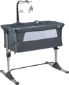Height adjustable dark gray baby side crib with music box, toys, and mesh for easy nighttime monitoring.