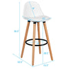 White mid-century barstool with beech wood legs, 28.5 inches high, featuring a padded seat and metal footrest for.