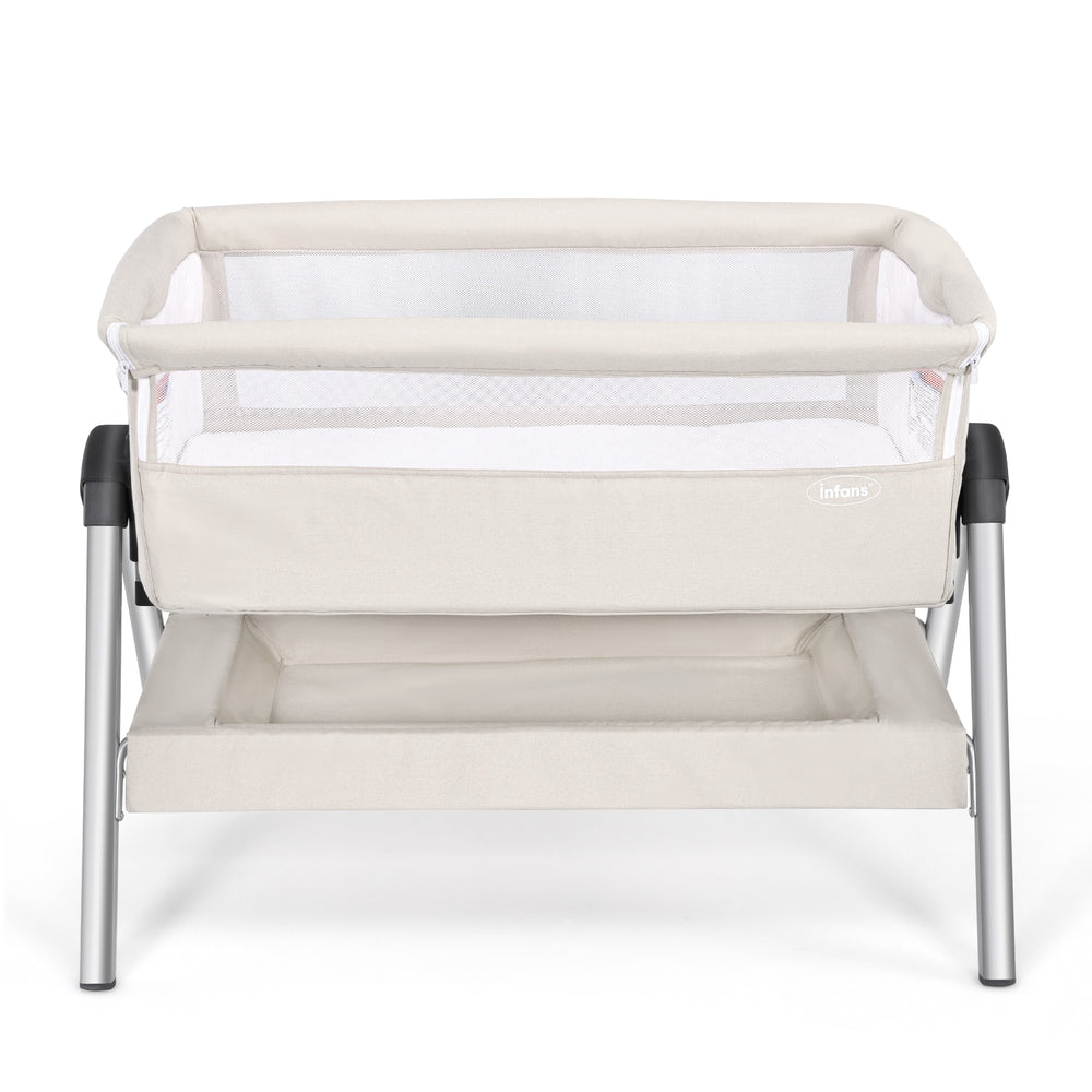Portable baby bedside sleeper in beige with adjustable height and angle, featuring a cotton mattress cover for comfort.