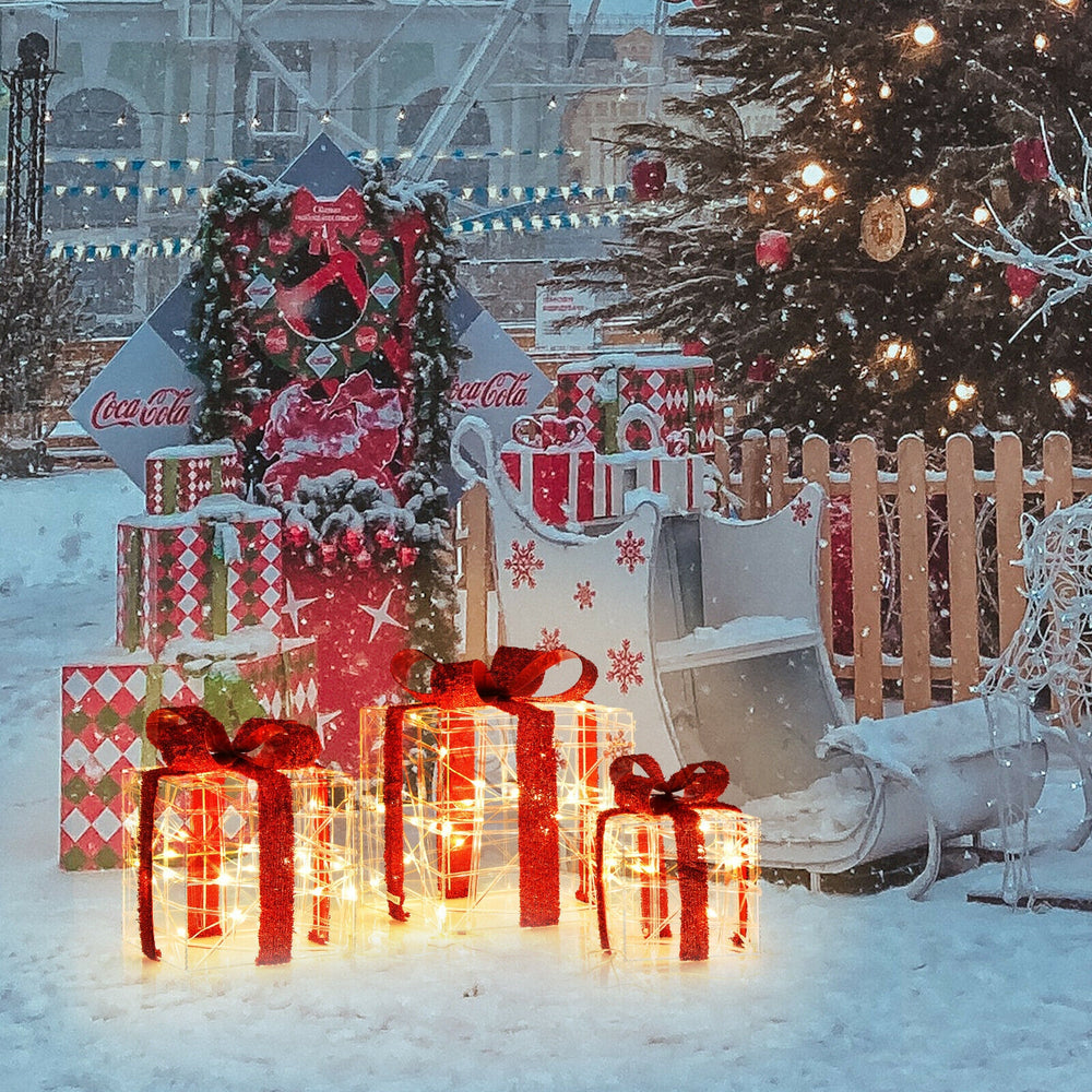Lighted Christmas gift boxes with 60 LED lights, perfect for indoor and outdoor holiday decorations.