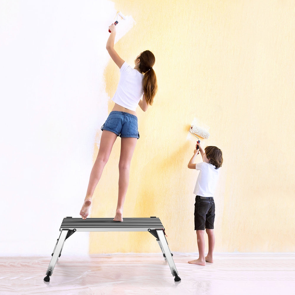 Aluminum folding step stool ladder with non-slip pads, supporting safe use for home projects like painting walls.