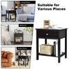 Black wooden storage shelf with drawer, featuring a wide tabletop and bottom shelf, ideal for bedroom and living room.