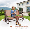 Swing glider chair with brown fabric and sturdy steel frame, ideal for relaxing in outdoor spaces like patios and.