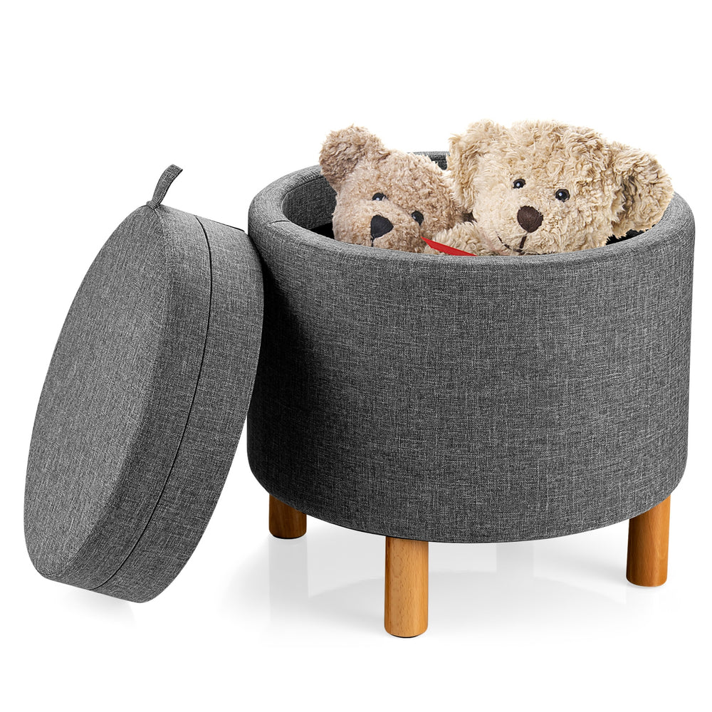Round gray fabric storage ottoman with removable lid, wooden tray, and soft padded seat for versatile use in any room.