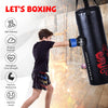 Child practicing boxing with a 40lbs filled punching bag, featuring professional gloves and a jump rope for warm-up.