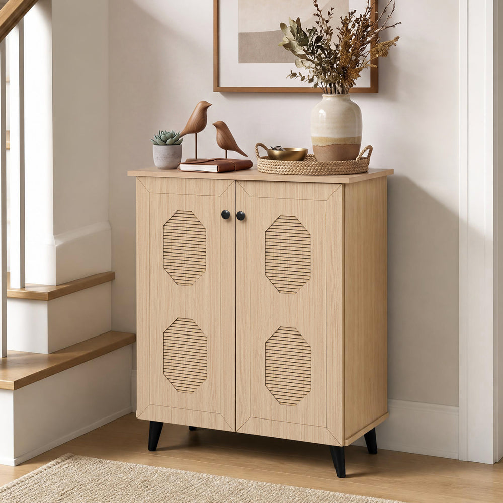 Natural 2-door geometric-style storage cabinet features carved panels, offering ample space for footwear in entryways.