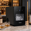 Compact black countertop ice ball maker features a see-through window and self-cleaning for easy maintenance and efficiency.