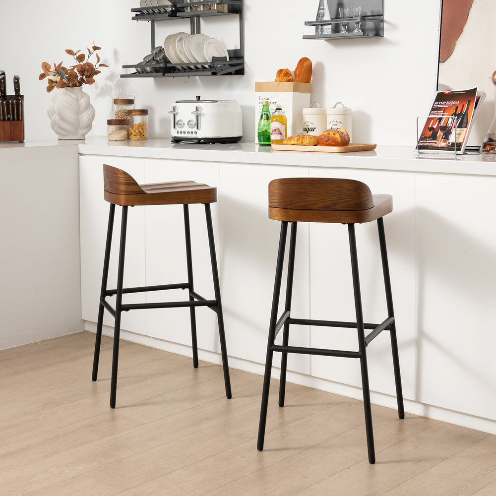 Industrial bar stools with low back and footrests, 29" height, perfect for kitchen islands or dining bars.