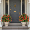 Two artificial rose topiary ball trees in decorative pots, featuring vibrant red flowers and lush green leaves for.