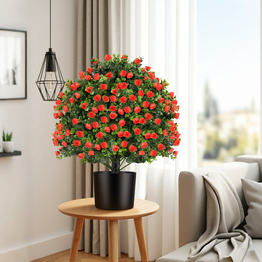 Artificial rose topiary ball tree with vivid red flowers and green leaves, perfect for home or office decor.