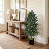 Artificial topiary cone tree with 49 purple flowers in a cement-filled pot, perfect for home or office decor.