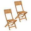 Two sturdy wood folding chairs with slatted backrests, perfect for outdoor events and space-saving in gardens or patios.