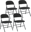 Set of four black folding chairs featuring a metal frame and PVC leather, ideal for indoor and outdoor use.