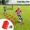 Red training cones for dribbling drills and agility practice, included in the portable soccer goals set with pitch marker cloth.