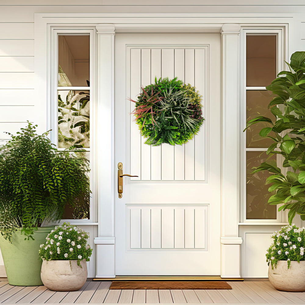 Square framed artificial foliage wall art featuring vibrant faux plants, perfect for indoor or outdoor decoration.