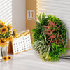 Square framed artificial foliage wall art with lush greenery, perfect for enhancing any balcony or office space.