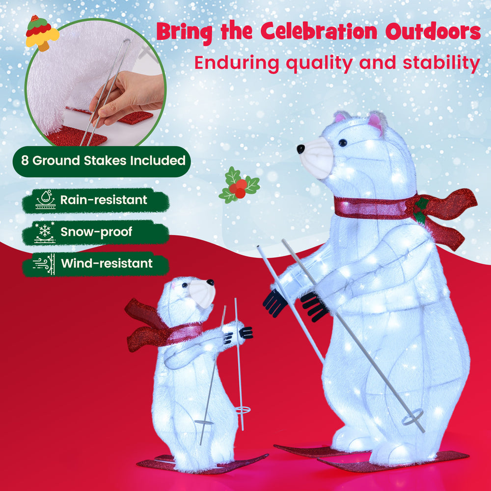 Animated skiing polar bears decoration with 160 LEDs, rain-resistant, and includes ground stakes for outdoor use.
