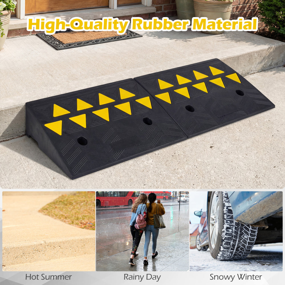 Driveway threshold ramps made of durable rubber, featuring reflective patterns and a textured surface for enhanced.