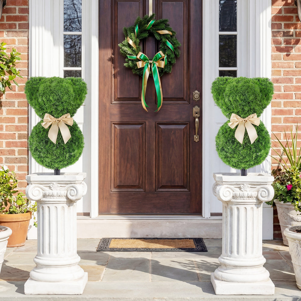 Two teddy bear topiary trees with golden bows, made of sun-resistant faux boxwood, perfect for outdoor spring displays.