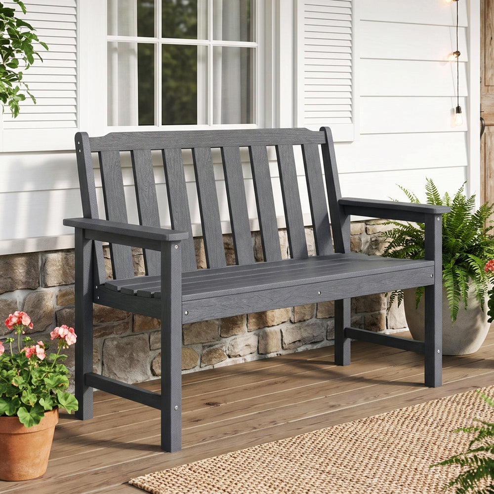 Gray 2-person outdoor garden bench made of weatherproof HDPE, featuring a backrest, armrests, and a classic wood-like texture.