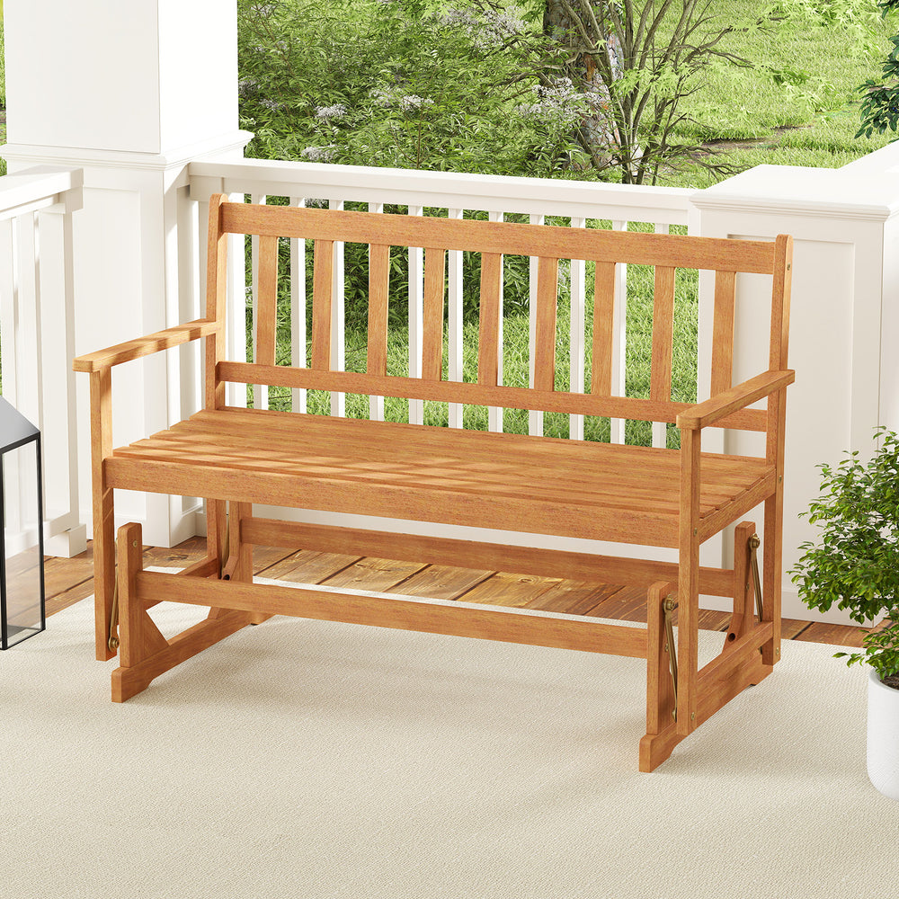 Acacia wood glider bench with slatted seat, perfect for outdoor relaxation on the patio or garden.