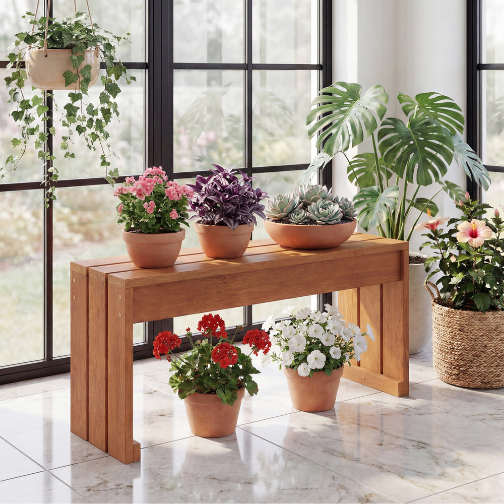 Solid wooden 2-person outdoor garden bench with potted plants, ideal for backyard or indoor use.
