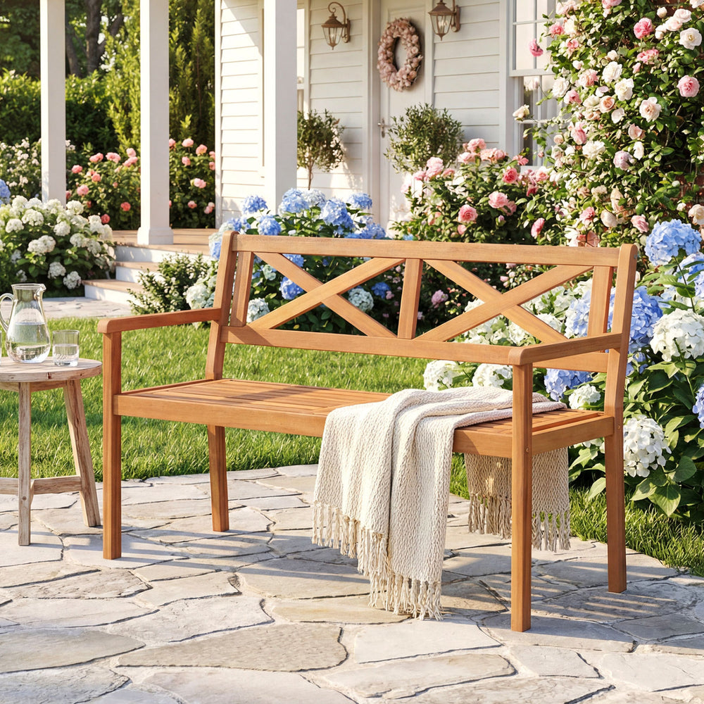 Acacia wood 2-person garden chair with armrests, slatted seat design, perfect for patio relaxation.