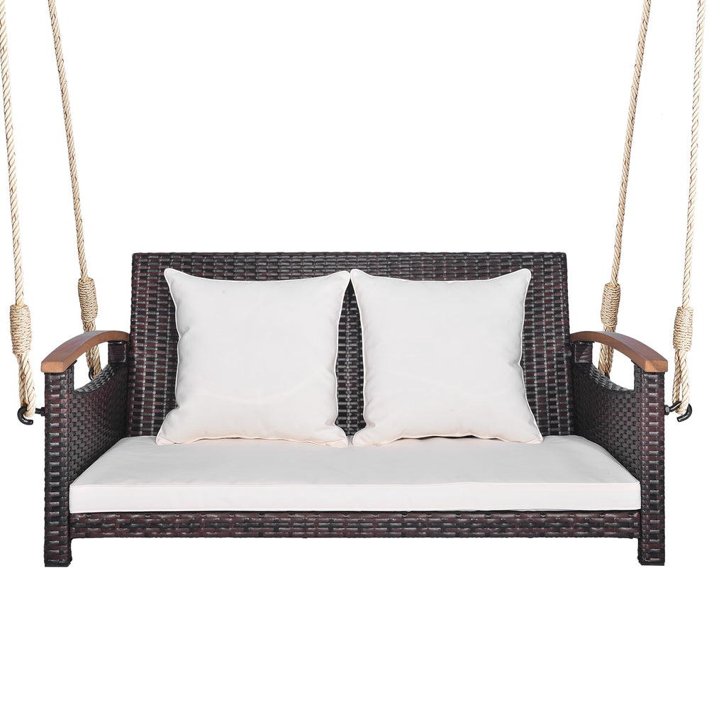 2-person patio rattan porch swing with cushions, sturdy hemp ropes, and a durable woven seat for backyard relaxation.