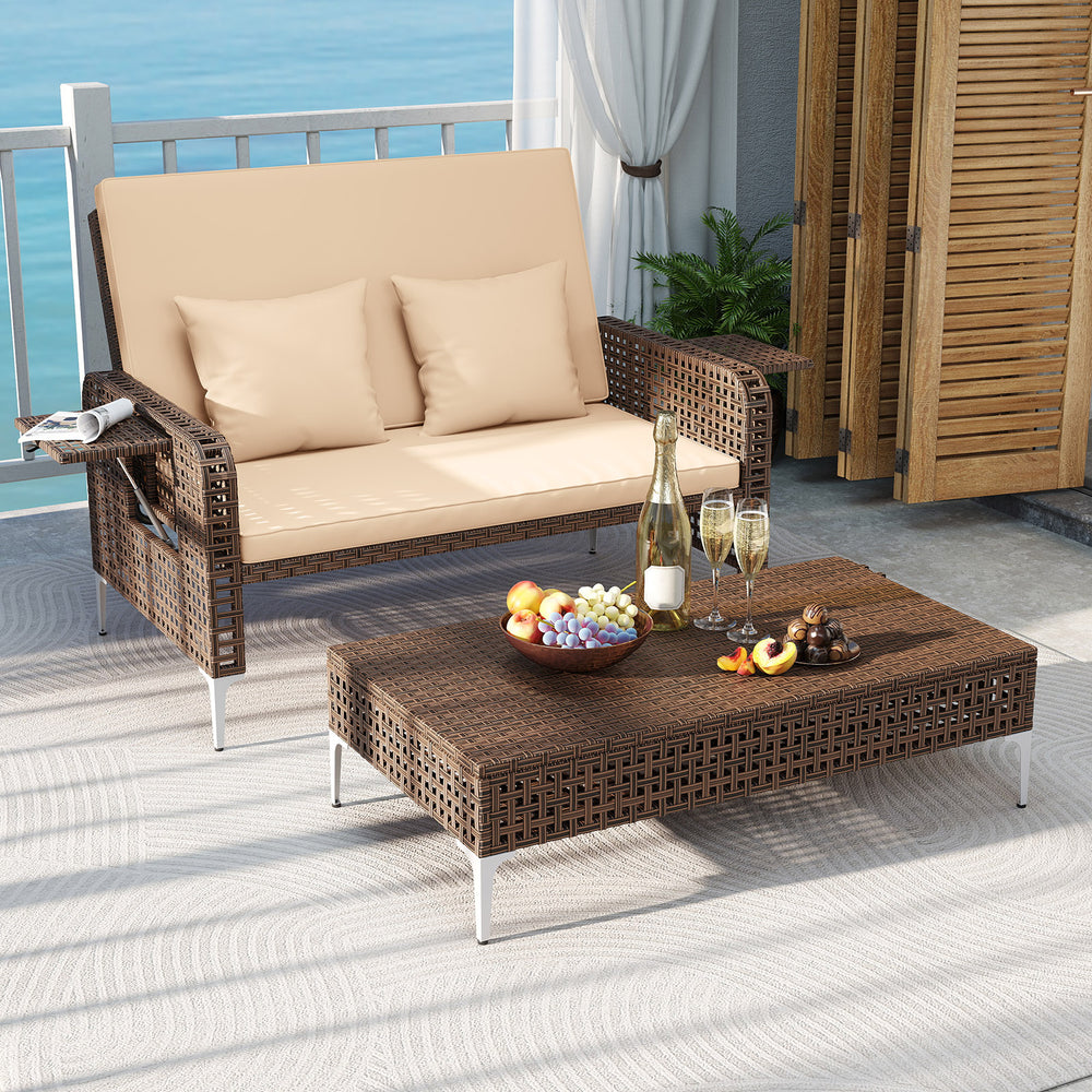 Brown rattan loveseat and ottoman set with adjustable backrest, ideal for backyard relaxation and outdoor comfort.