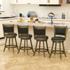 Set of two 24-inch gray swivel counter stools with upholstered seats, ideal for kitchen or dining use.