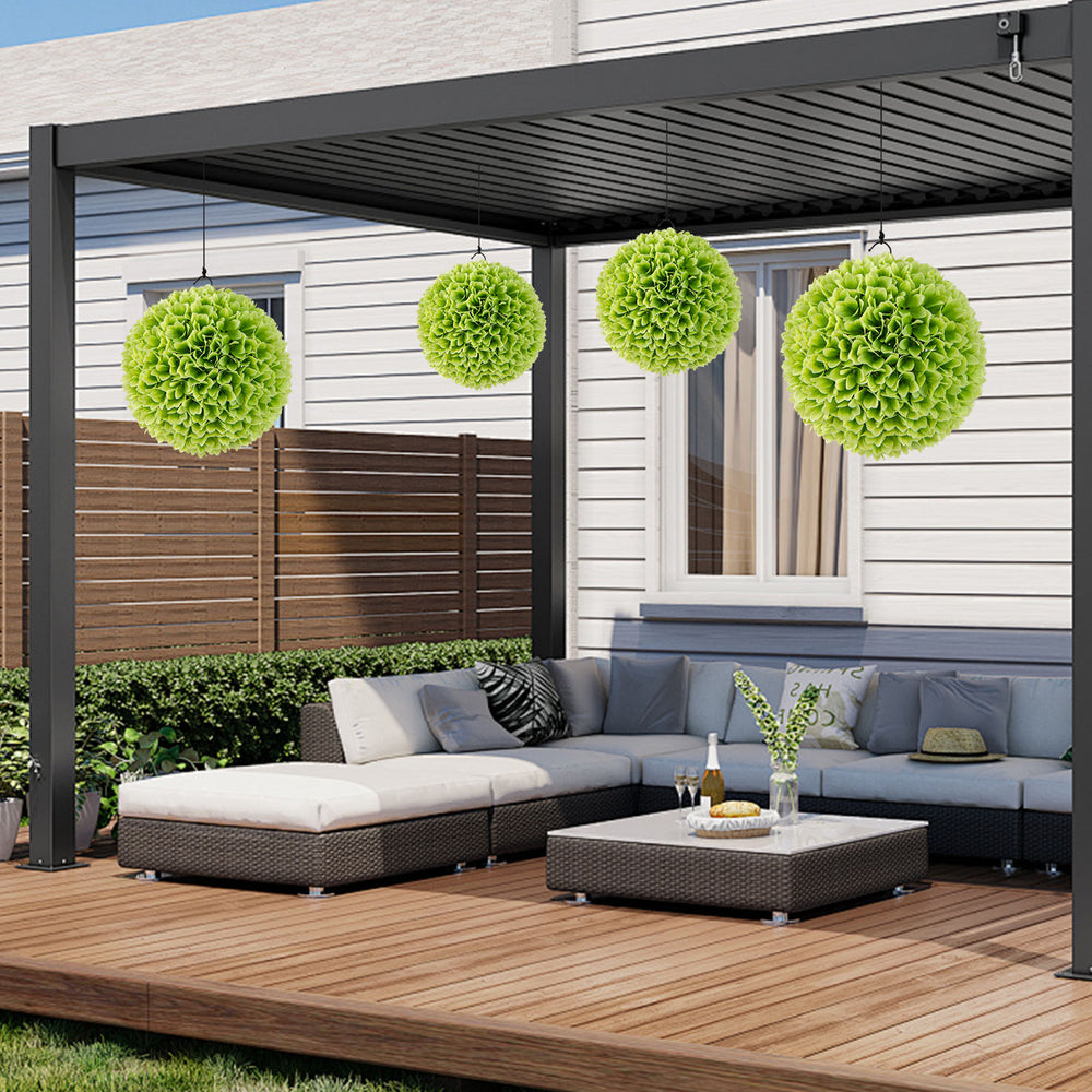 Artificial green topiary balls hanging in a patio setting, perfect for vibrant outdoor decoration and easy maintenance.