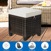 Rattan ottoman with removable beige cushion, sturdy steel frame, perfect for outdoor seating or as a coffee table.