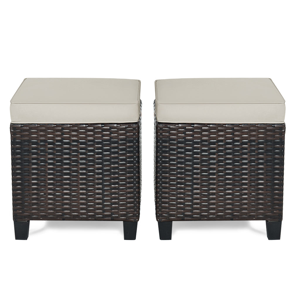 Two-piece patio rattan ottoman set with beige removable cushions, ideal for outdoor seating or as a footrest.