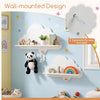 Floating cloud shelves in white for wall-mounted storage, perfect for books and toys in a nursery or playroom.