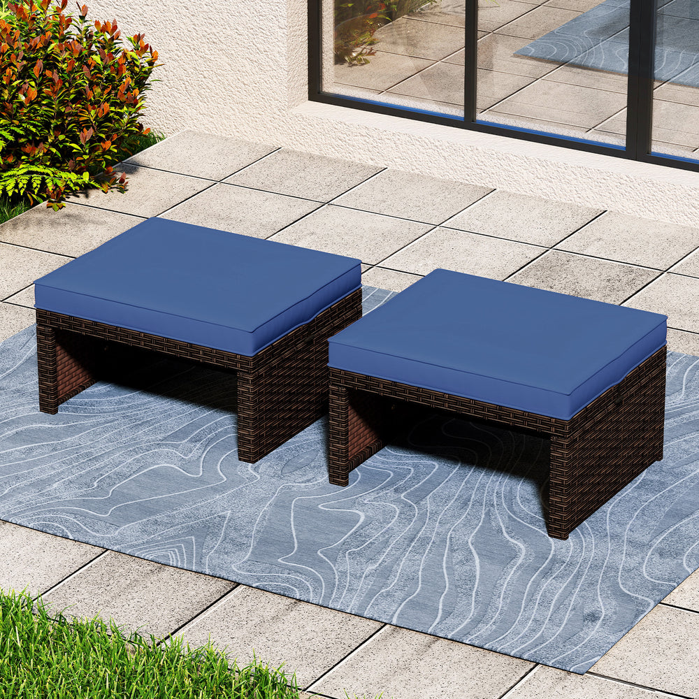 Navy blue PE rattan ottomans with cushions, perfect as footrests or extra seating for outdoor patio relaxation.