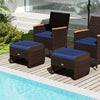 Two navy PE wicker ottomans with removable cushions, perfect for outdoor patio use as footrests or extra seating.
