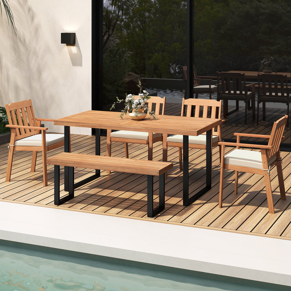 Acacia wood patio dining chairs with white cushions, featuring a spacious seat and tilted backrest for comfort.