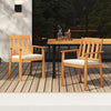 Two acacia wood patio dining chairs with white cushions, perfect for outdoor dining on a deck or balcony.