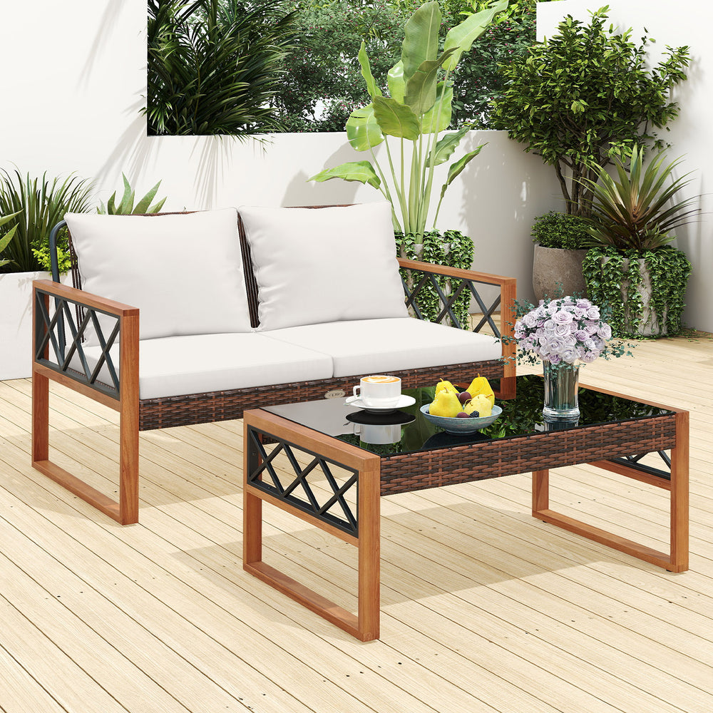2-piece patio furniture set featuring a white cushioned loveseat and glass-top coffee table, perfect for outdoor.