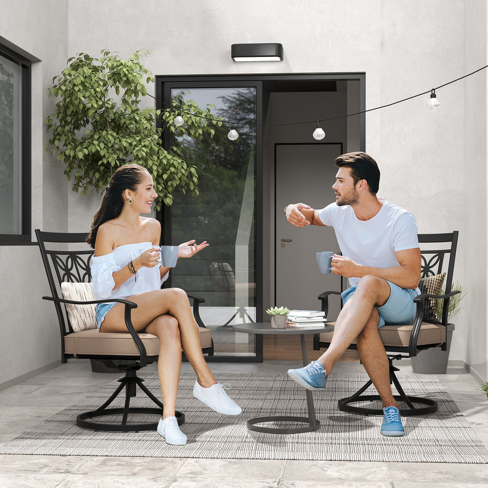 Two people enjoying coffee on black patio swivel chairs with blossom pattern backrest and cushions, perfect for outdoor.