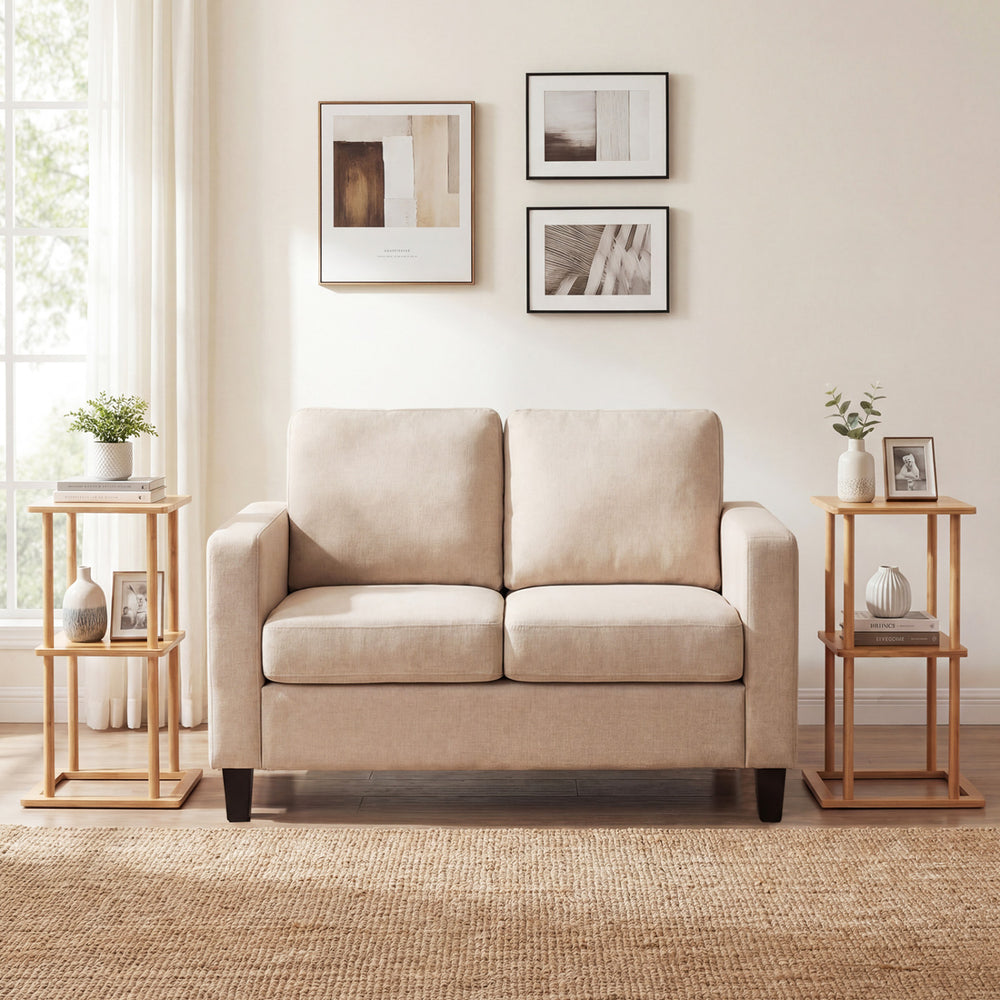 Natural bamboo side table with storage shelves, featuring a sturdy base and versatile design for living room use.