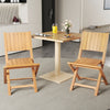 Two teak wood outdoor dining chairs with slatted seats, perfect for patio or garden use, showcasing a natural finish.