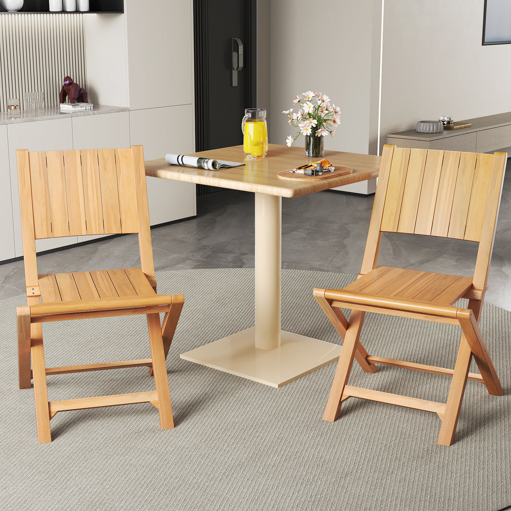 Two teak wood outdoor dining chairs with slatted seats, perfect for patio or garden use, showcasing a natural finish.